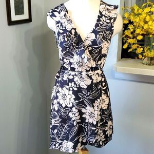Cute wrap around dress, size small,  NWT. Black and cream with ruffle.